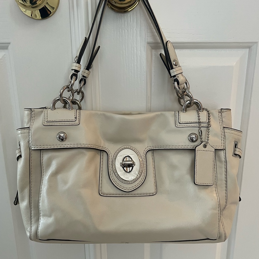 Cream, leather, medium Coach bag. Comes with the dust bag.
